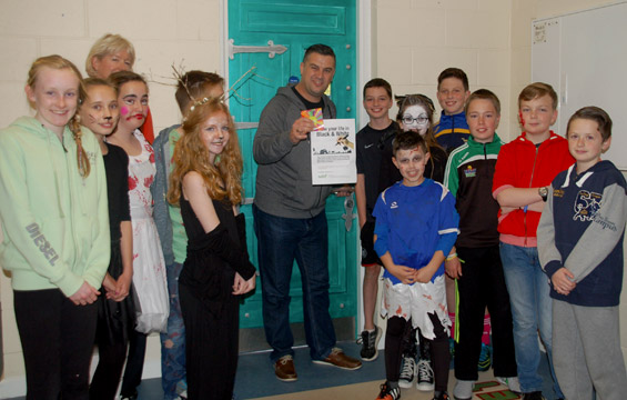 Mrs Butler and the Sixth Class students with Ethan Hynes